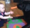black labrador with carrot and baby